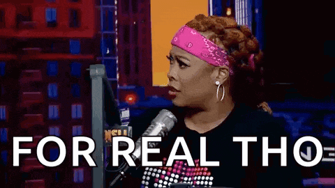 a woman is sitting in front of a microphone with the words `` for real tho '' written on the screen .