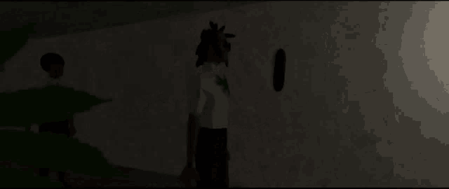 a man is laying on the floor with a gun in his hand in a dark room .