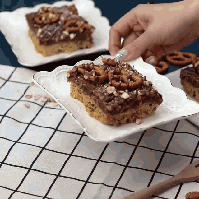 a piece of cake with pretzels and nuts on top