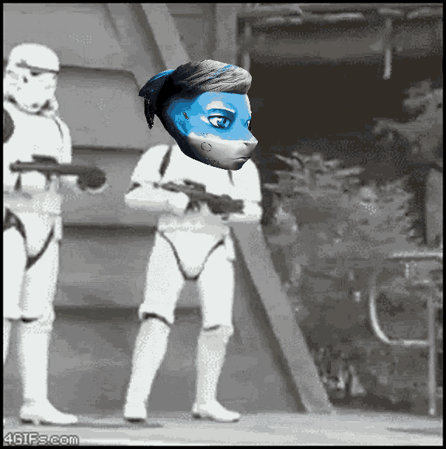 a storm trooper with a blue mask on his head is standing next to another storm trooper