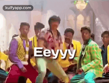 a group of men are dancing in a room with the words eeyyy written on the bottom .