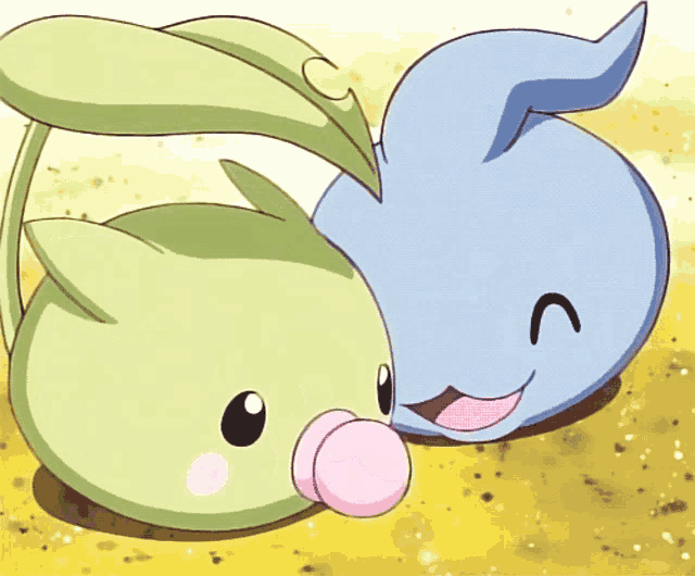 a blue and green cartoon character with the letter c on their faces