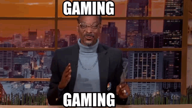 a man in a suit and turtleneck sweater says gaming gaming
