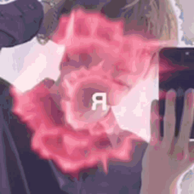 a man is taking a picture of himself with a cell phone .