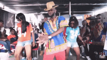 a group of people are dancing and one of them has the number 34 on his shirt