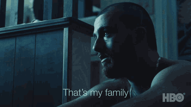 a man in a dark room with the words that 's my family on the bottom right
