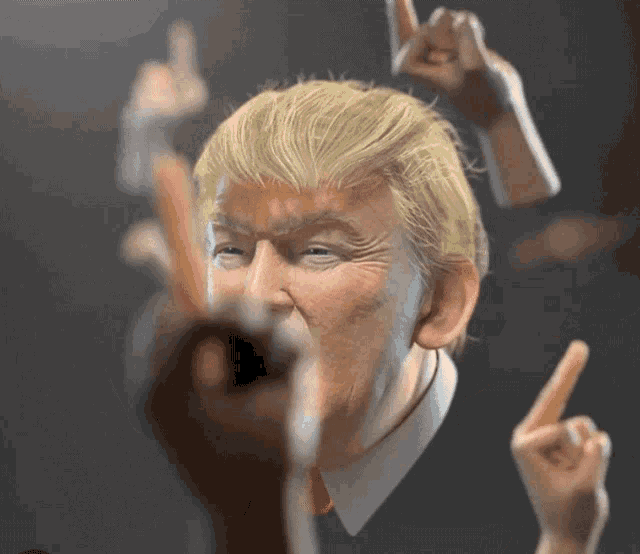 a close up of donald trump 's face with many hands pointing at him