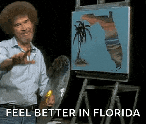 bob ross is standing in front of a painting of florida