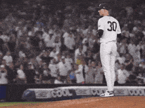 a baseball player with the number 30 on his shirt