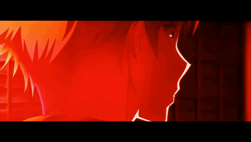 a close up of a person 's face with a red light behind them