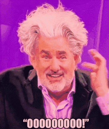 a man with white hair and a beard is smiling and says " 00000000 "