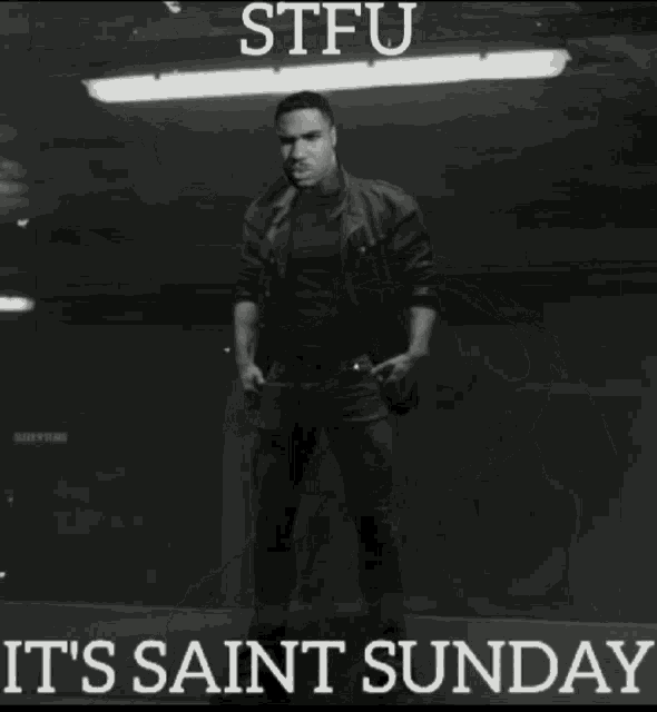 a black and white photo of a muscular man with the words stfu it 's saint sunday