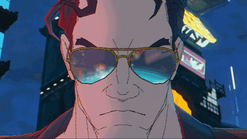 a man wearing sunglasses stands in front of a sign that says " tnt "