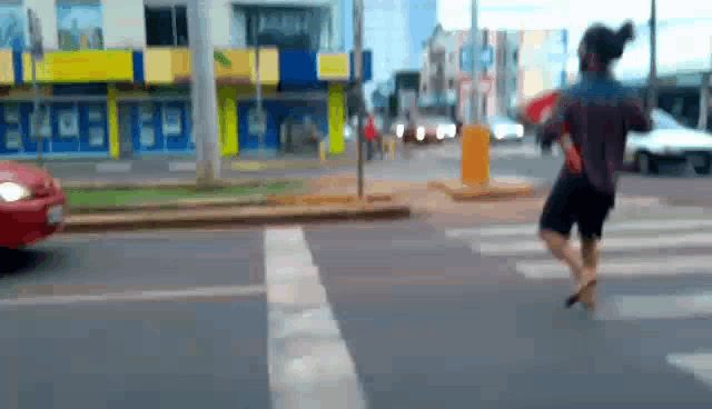 a blurry picture of a person crossing a street with a store in the background that says ecb