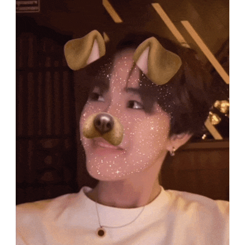 a man wearing a dog mask on his face looks at the camera