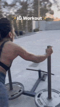 a woman is pushing a sled with weights on it and the caption says ig workout