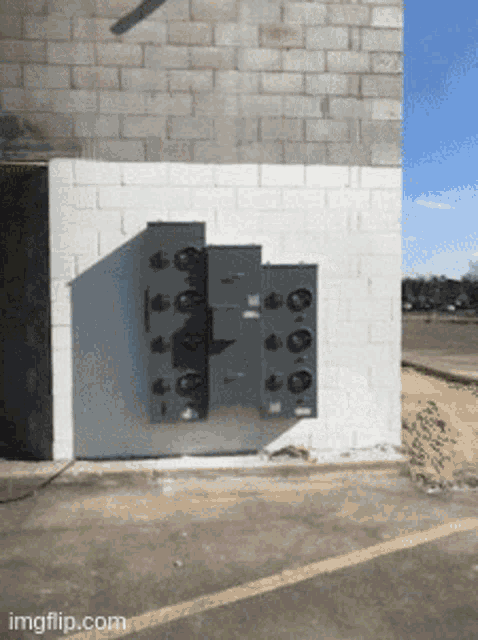 a white brick wall with a bunch of boxes on it and imgflip.com at the bottom
