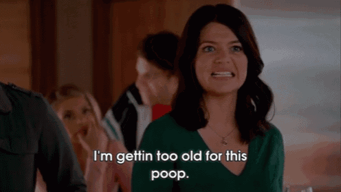 a woman in a green shirt is saying i 'm gettin too old for this poop .