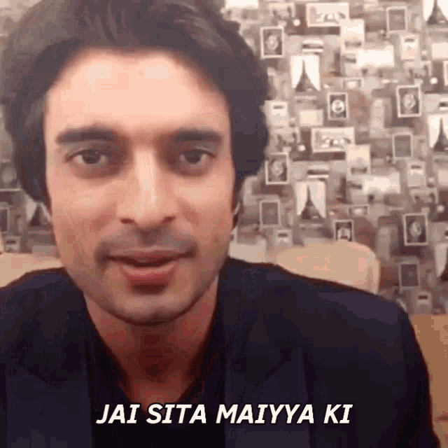 a close up of a man 's face with the words jai sita maiiya ki written on the bottom
