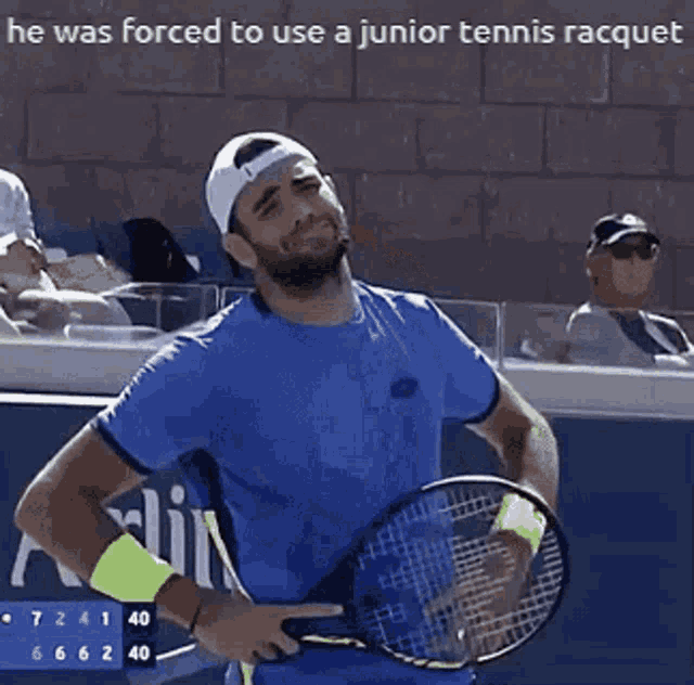 a man holding a tennis racquet with the words he was forced to use a junior tennis racquet written above him
