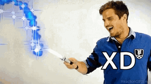 a man in a blue shirt with xd on it