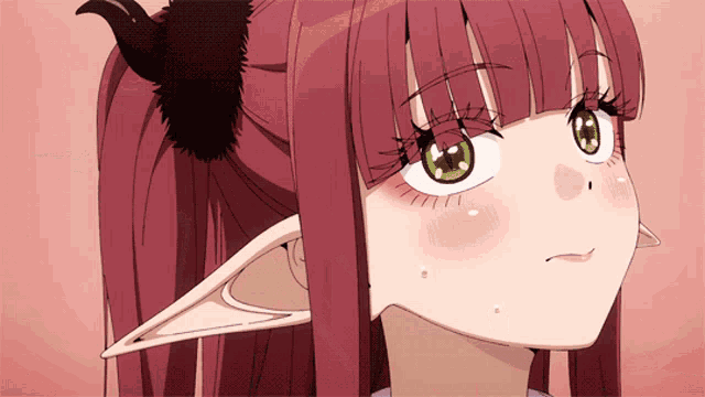 a girl with long red hair and green eyes