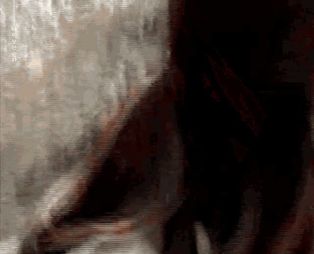 a blurred image of a person 's face with chinese writing