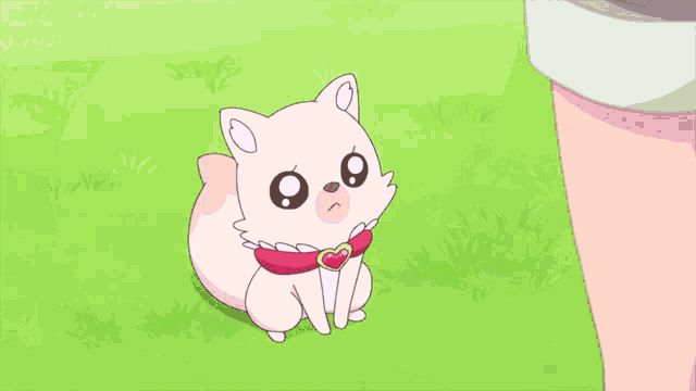 a baby wearing a red and white outfit with a heart shaped bib