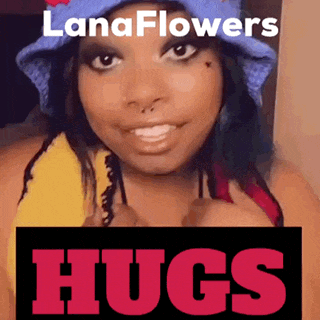 a woman is wearing a blue hat and holding a sign that says lanaflowers hugs