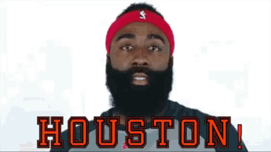 a man with a beard is wearing a headband that says houston on it