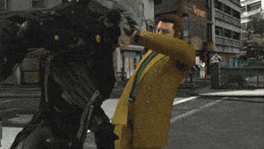 a man in a yellow suit is being attacked by a robot
