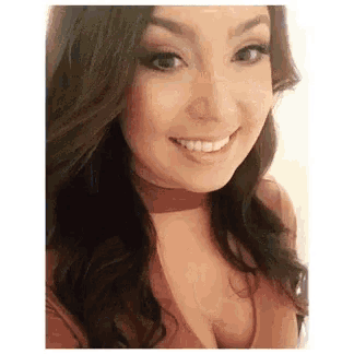 a woman is smiling for the camera while wearing a choker .