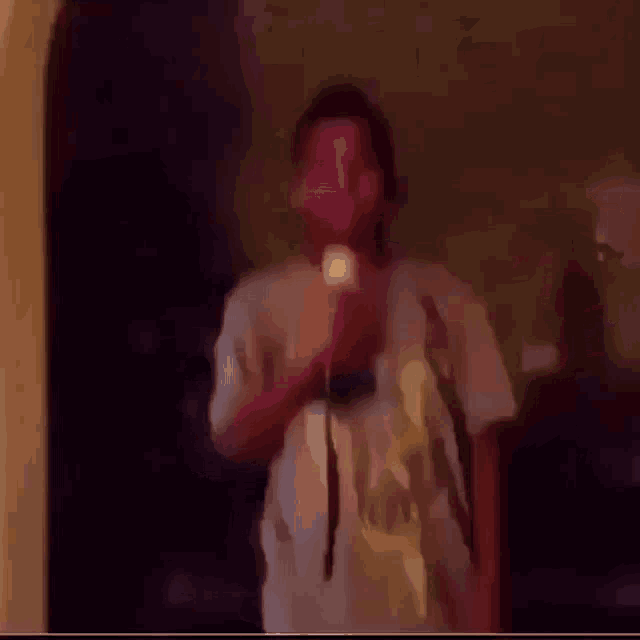 a blurry picture of a person 's face with a blue sky behind them