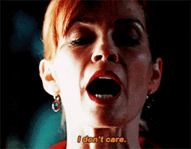 a close up of a woman 's face with the words " i don 't care " visible