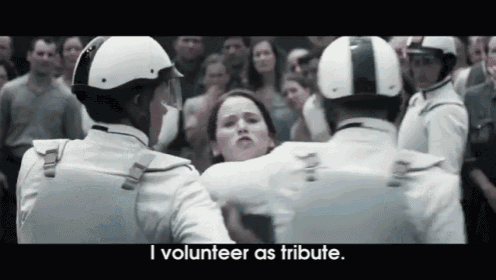a woman is being held by a group of police officers with the words i volunteer as tribute