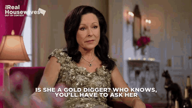 a woman in a gold dress says " is she a gold digger who knows "