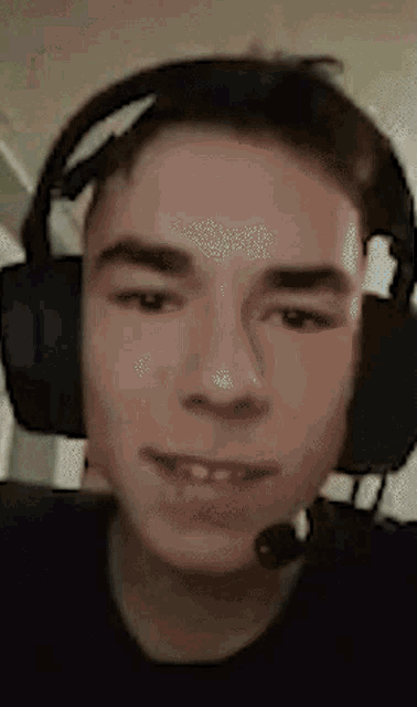 a young man wearing headphones and a microphone