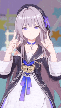 a girl in a black and white dress is making a peace sign with her fingers
