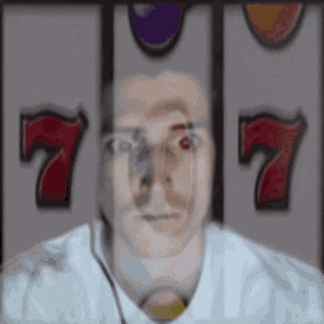 a man 's face is visible in front of a slot machine that has the number 7 on it