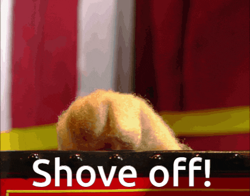 a sign that says shove off is behind a stuffed animal