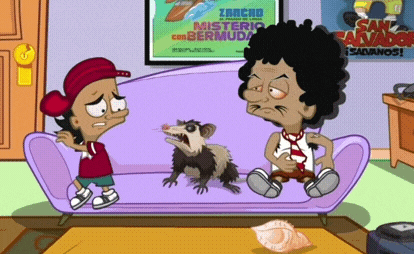 two cartoon characters are sitting on a couch with a poster behind them that says zancho