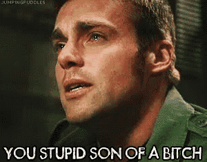 a close up of a man 's face with the words you stupid son of a bitch above him