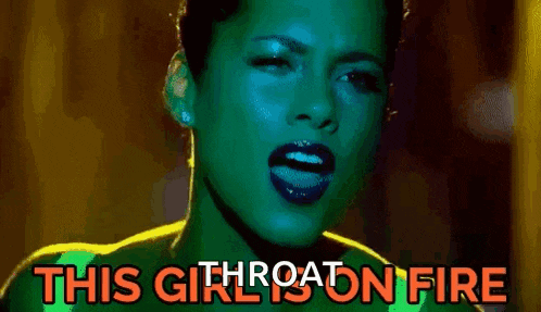 a close up of a woman 's face with the words `` this girl is on fire '' written on the bottom .