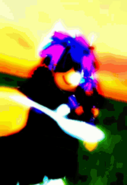 a blurry picture of a person with a purple and blue hat
