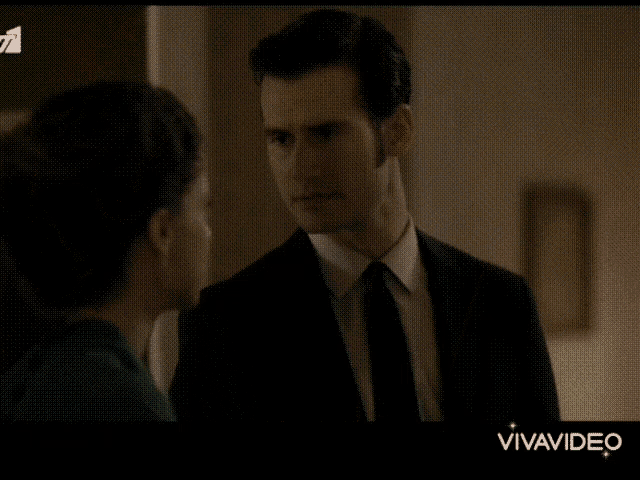 a man and a woman are looking into each other 's eyes and the word vivavideo is on the bottom of the screen