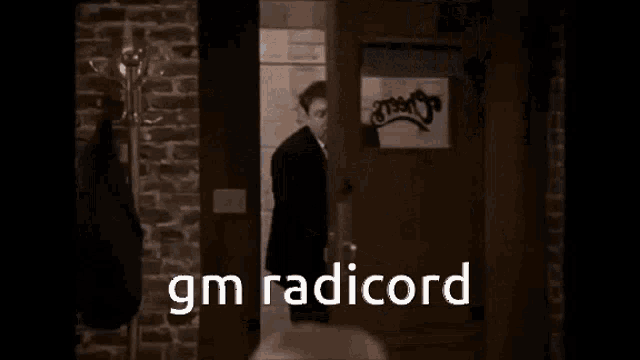 a group of men are sitting at a bar with the words gm radicord written on the screen