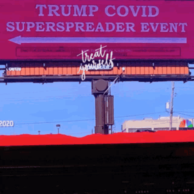 a trump covid superspreader event is being advertised on a billboard