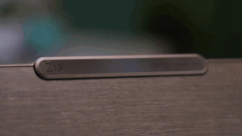 a close up of a keyboard with dolby atmos speaker system written on it
