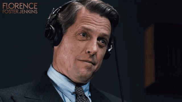 a man wearing headphones with the name florence foster jenkins on the bottom right