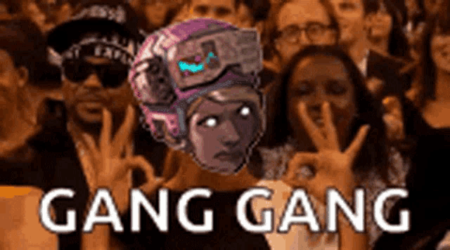 a group of people are making peace signs in front of a picture of a woman with a helmet on .